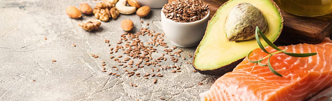 Healthy fats in nutrition - salmon, avocado, oil, nuts. Concept of healthy food